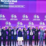 Narendra Modi with tech leaders at the India AI Impact Summit 2026. Photo: India AI Impact Summit