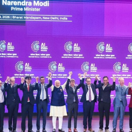 Narendra Modi with tech leaders at the India AI Impact Summit 2026. Photo: India AI Impact Summit