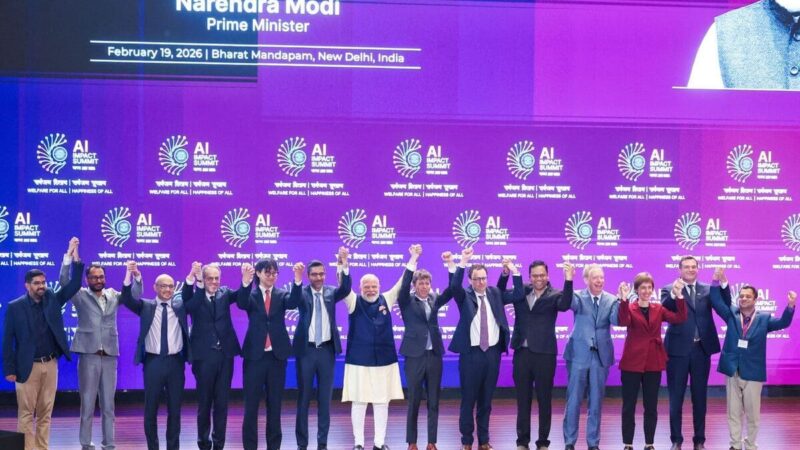 Narendra Modi with tech leaders at the India AI Impact Summit 2026. Photo: India AI Impact Summit