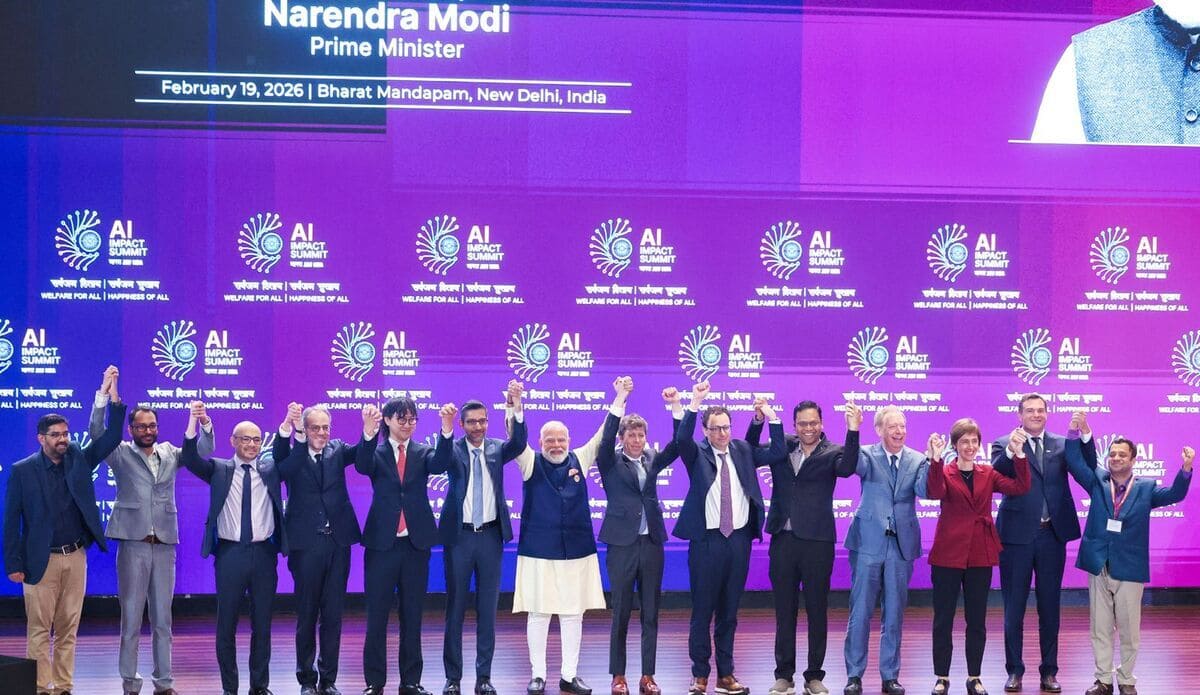 Narendra Modi with tech leaders at the India AI Impact Summit 2026. Photo: India AI Impact Summit